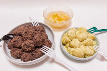 Rice cakes made with bean flour and mashed adzuki beans, Watery Kimchi (mulgimchi, mulkimchi), Korean traditional food, dessert, Injeolmi, tteok, homemade food.