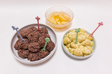 Rice cakes made with bean flour and mashed adzuki beans, Watery Kimchi (mulgimchi, mulkimchi), Korean traditional food, dessert, Injeolmi, tteok, homemade food.
