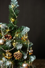 Christmas tree in Golden decorations. Different shades of gold. Gift boxes. Close up. Macro photo. Holiday. Happy Christmas. Side.