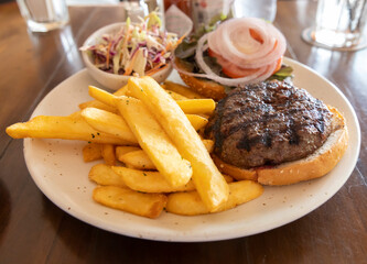 Wagyu beef burger with French fries and coleslaw