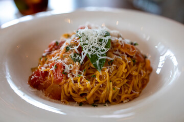 Spaghetti with tomato sauce and Parmesan cheese