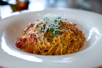Spaghetti with tomato sauce and Parmesan cheese