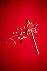 Christmas lollipop on the red background