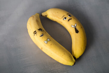Banana character with funny face on gary background.