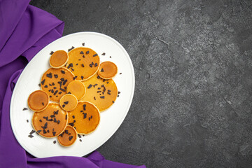 top view yummy pancakes with choco chips on a dark background cake sweet dessert