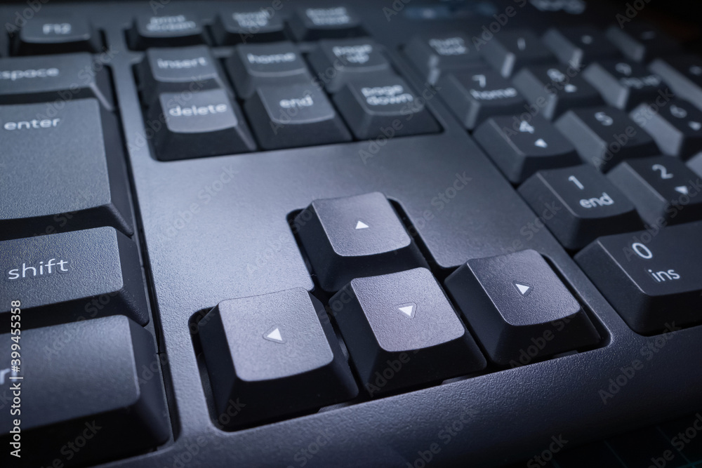 Poster up, down, left, and right keys on a computer keyboard. close-up of the keyboard keys. arrow keys. mo