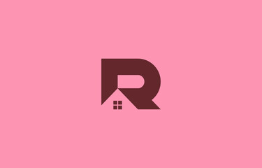 real estate home logo design in letter R shape isolated on pink background