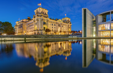 Fototapeta na wymiar The Reichstag and part of the Paul-Loebe-Haus at the river Spree in Berlin at dawn