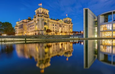 Deurstickers The Reichstag and part of the Paul-Loebe-Haus at the river Spree in Berlin at dawn © elxeneize