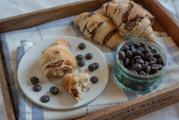 home made croissant filled with chocolate on a plate