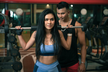 fitness woman with trainner in gym