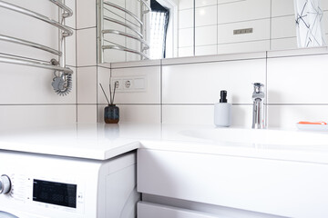 Modern bathroom at home. White stone table in bathroom and new mixer