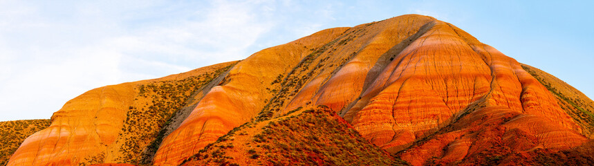 Big Bogdo mountain. Red sandstone layers outcrops on the slopes sacred mountain in Caspian steppe...