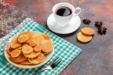 Breakfast with classic simple pancakes and a cup of tea