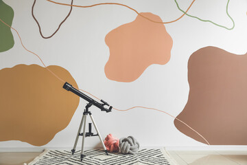 Interior of stylish room with modern telescope