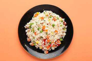Bowl with tasty pilaf on color background