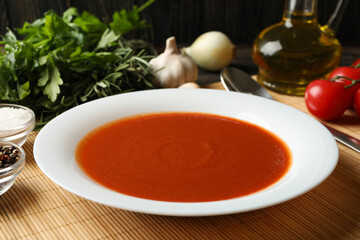 Concept of tasty dinner with tomato soup, close up