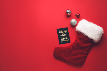 Composition with Christmas sock on color background