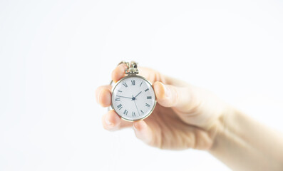 Vintage watch in the girl's hand. The concept of a bygone time.