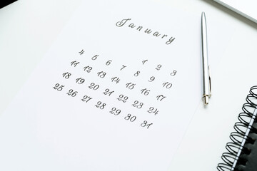 February calendar with pencil and planing on white desk