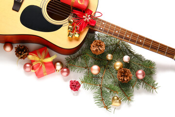 Guitar and Christmas decor on white background