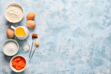 Ingredients for preparing pumpkin pie on color background