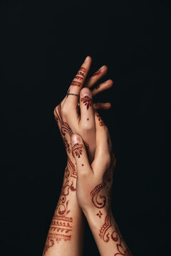 Beautiful Female Hands With Henna Tattoo On Dark Background