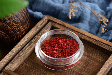 Close-up pictures of traditional Chinese medicine saffron on the background of retro Chinese style