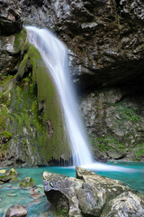 Beautiful waterfall falling from a rock covered by moss. Kot waterfall, San Leonardo, Cividale del Friuli, Udine province, Friuli Venezia Giulia region, Italy. Valli del Natisone nature. © Marco