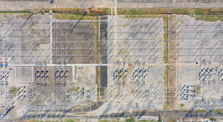 Aerial view of electricity generating, voltage poles. Power lines on utility tower and cable wires...
