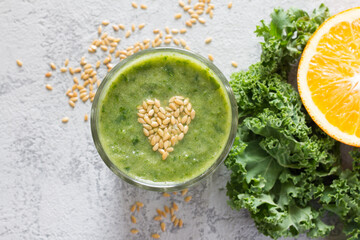 Healthy green smoothie with heart of seeds linseed