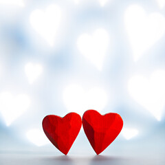 Two red small wooden hearts as symbol of love on Valentine's Day