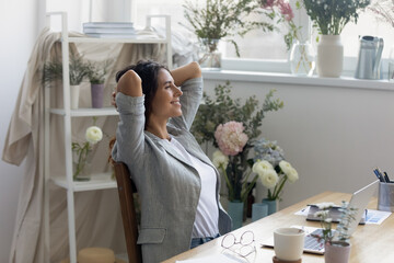 Moment of relax. Serene businesswoman florist owner of flower delivery service rest of computer...