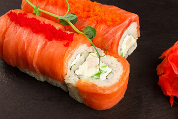 Japanese food: Set of different salmon sushi and rolls