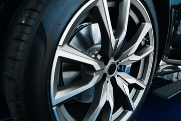 Aluminium rim of luxury car wheel close up