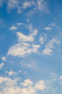 Vertical image white clouds in blue sky