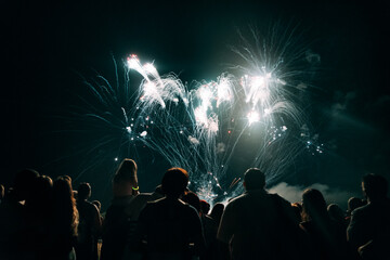 Crowd watching fireworks and celebrating new year eve