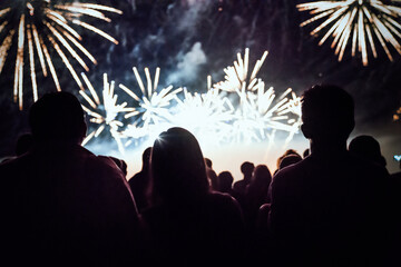Crowd watching fireworks and celebrating new year eve