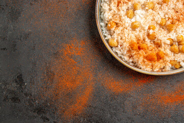 Easy meal with chickpeas and rice on the left bottom corner of mixed colr background