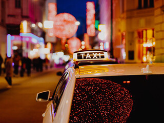 Taxi car during night in the city of Vienna, Austria