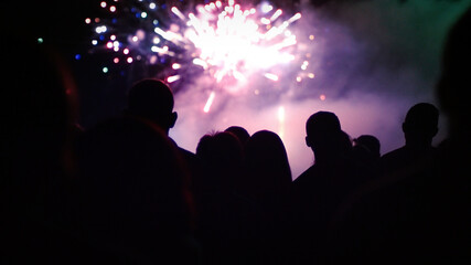 Fototapeta premium Crowd watching fireworks and celebrating new year eve