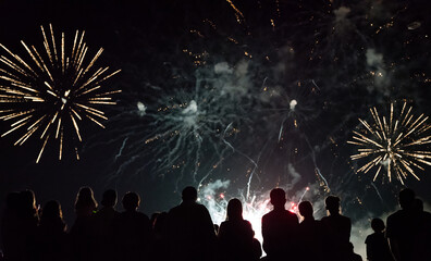 Crowd watching fireworks and celebrating new year eve