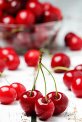 A small glass bowl with ripe fresh cherry