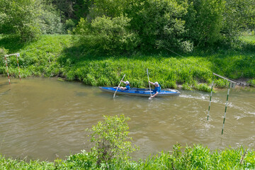  man and woman in a kayak compete on the river