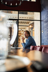 Reserved gentleman working alone in the office