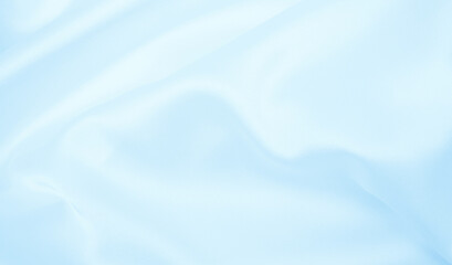 Smooth elegant blue silk or satin luxury cloth texture as abstract background. Luxurious background design
