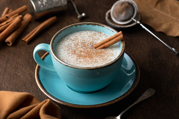 Turkish traditional hot drink salep on wooden background, selective focus