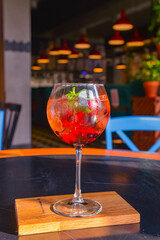 Fruit healthy cocktail from blackberries and raspberries. Delicious alcohol drink with berries inside.