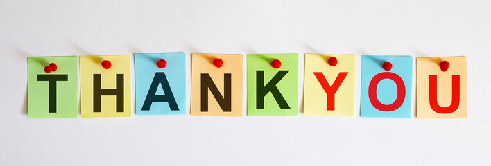 THANK YOU phrase is written on multi-colored stickers, on the white background. Business concept, strategy, plan