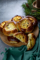 Traditional Russian baking pastry vatrushka, round buns, curd tart selective focus, closeup. Cheesecake with cottage cheese. Rustic food Photography.